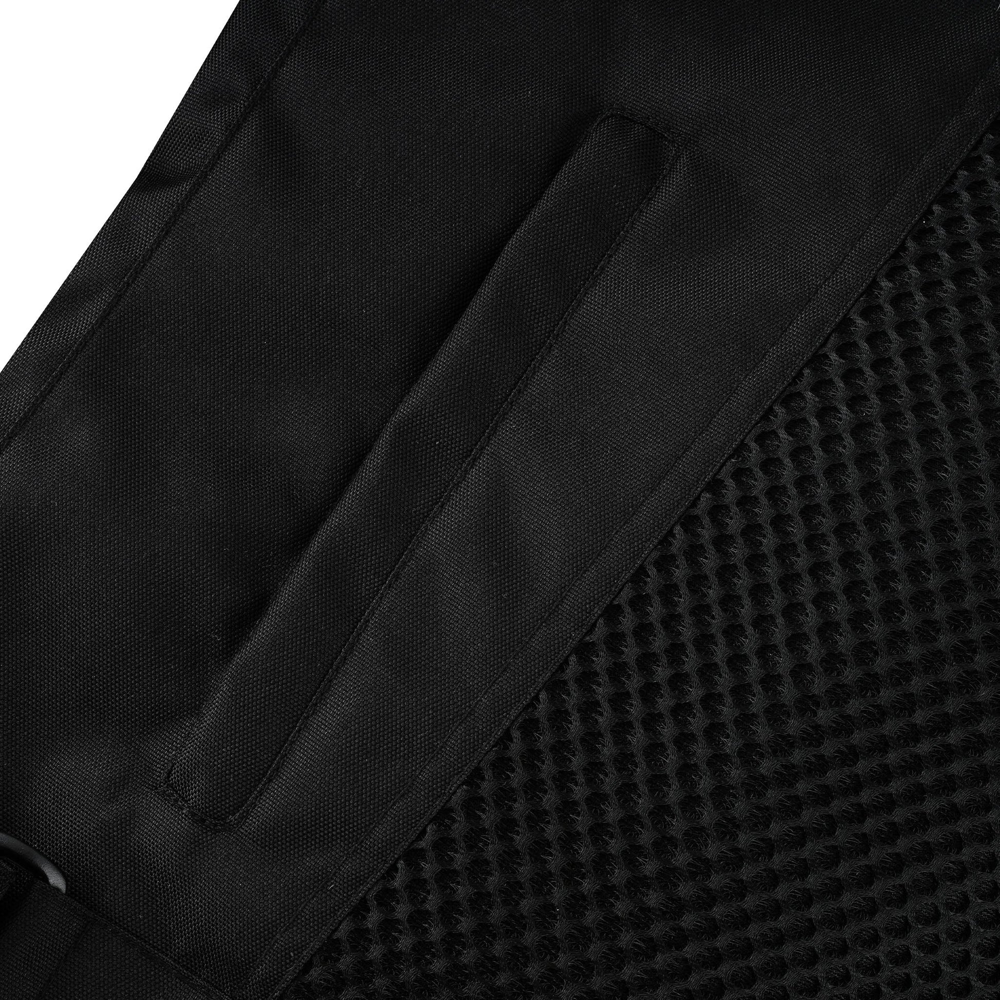Close-up of the internal opening flap for the back armor pocket, set against the breathable hexagonal mesh lining of the jacket.