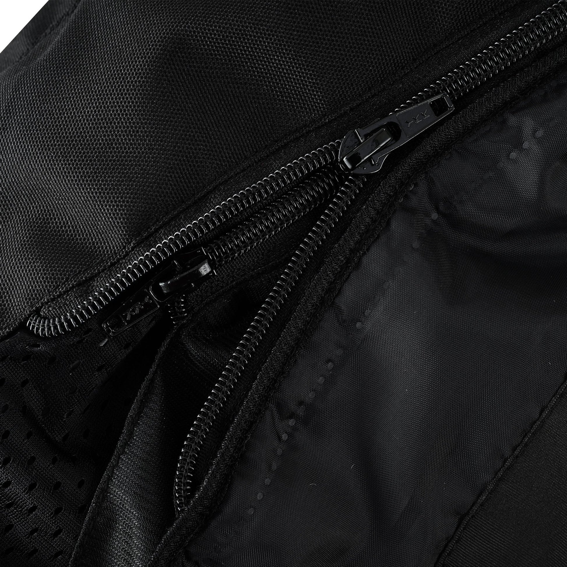 Close-up view of three distinct parallel zippers in the jacket's interior, showing the heavy-duty main zipper and two lighter zippers likely for attaching the thermal and/or waterproof liner(s).
