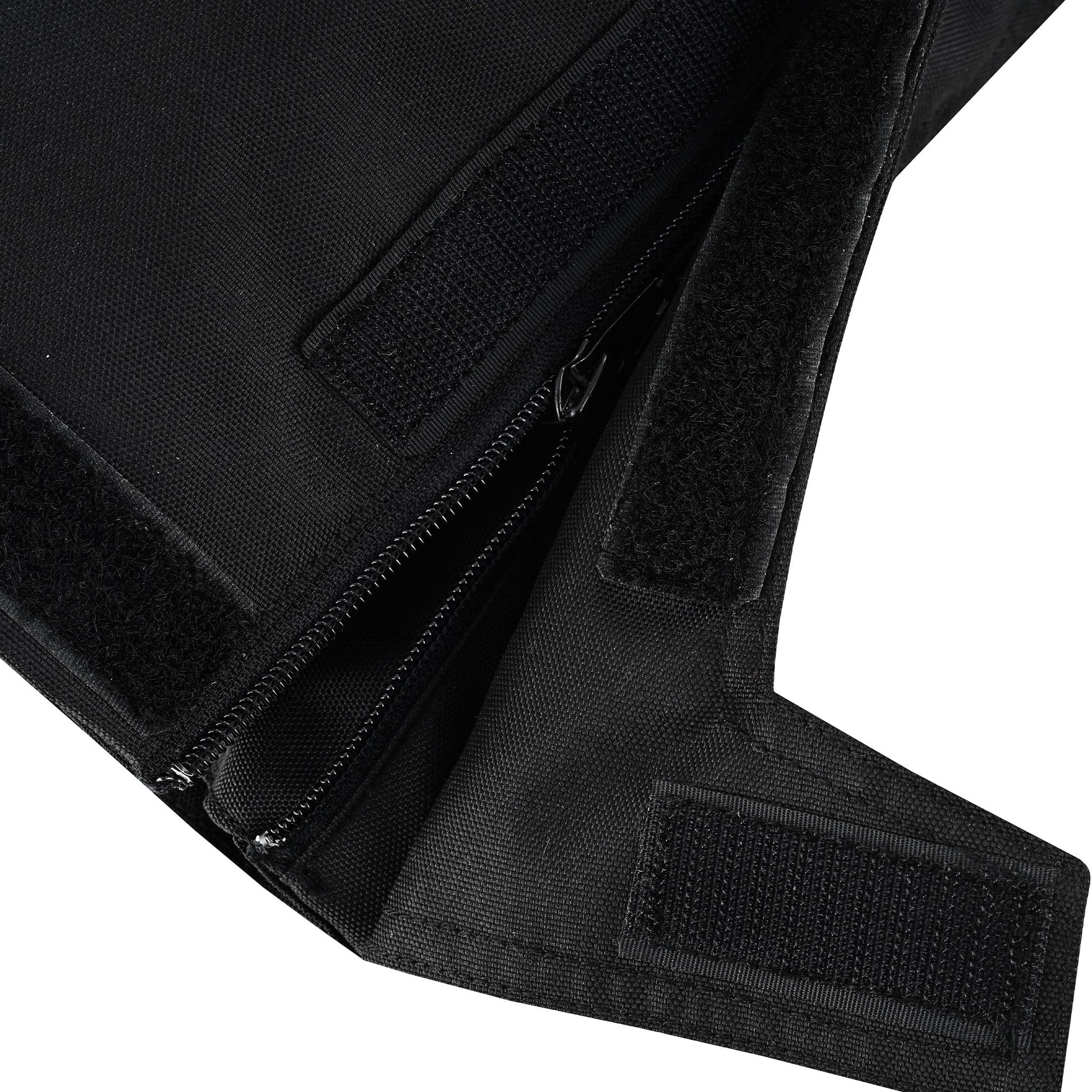 Extreme close-up of the lower leg closure system, showing a durable zipper, a textile gusset flap, and hook-and-loop (Velcro) panels for adjusting the fit over riding boots.